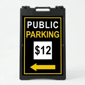 Custom black and yellow parking rate directional A-frame sign with white rate display box and yellow arrow for Los Angeles parking lot or event venue