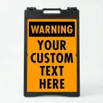 Custom orange and black warning A-frame sign with bold WARNING header and custom text zone for Los Angeles construction site parking lot or commercial facility