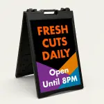 Custom black purple and orange geometric A-frame sign with bold orange message text on black panel and white additional text and phone number on colorful geometric lower section for Los Angeles creative business salon or cafe