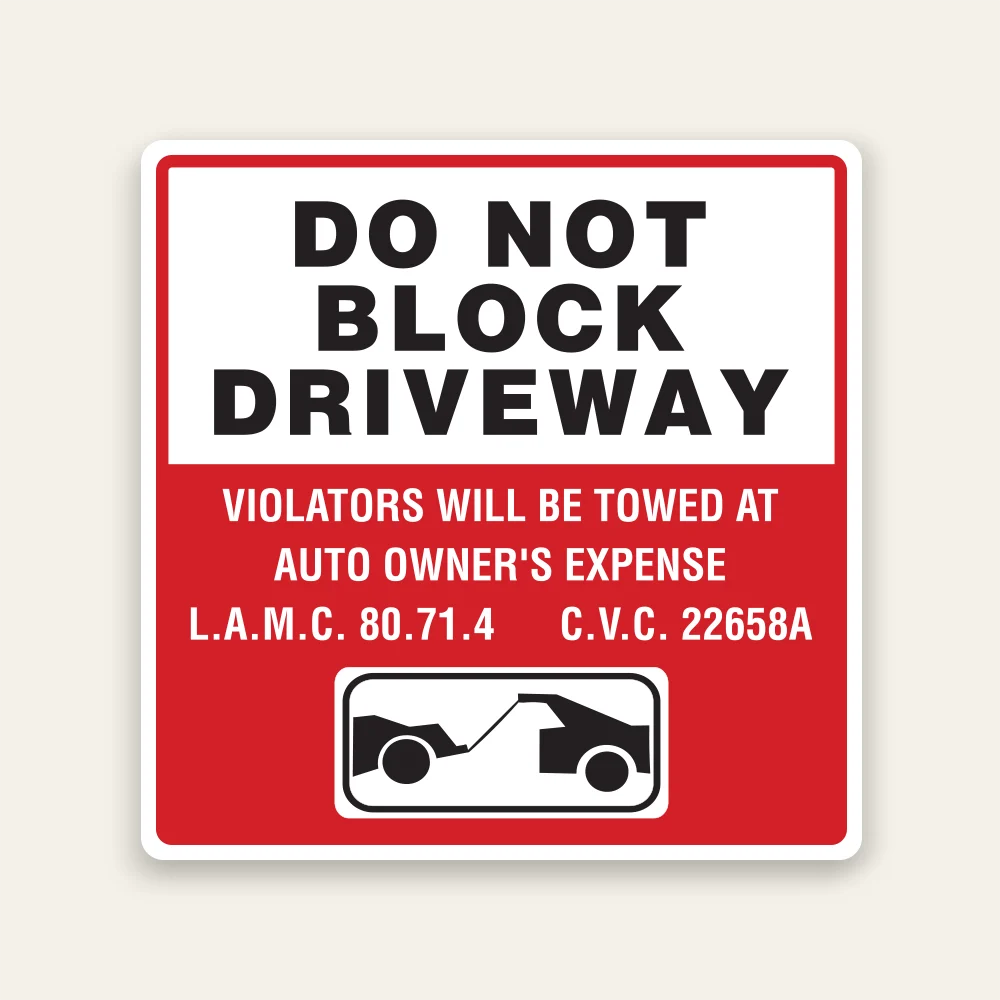 Red and white Do Not Block Driveway sign with tow-away warning, L.A.M.C. 80.71.4, C.V.C. 22658A citation, and tow truck icon.