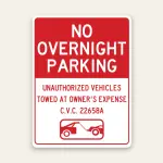 Red and white No Overnight Parking sign with bold white header text, unauthorized vehicles tow-away warning, C.V.C. 22658A, and tow truck icon.