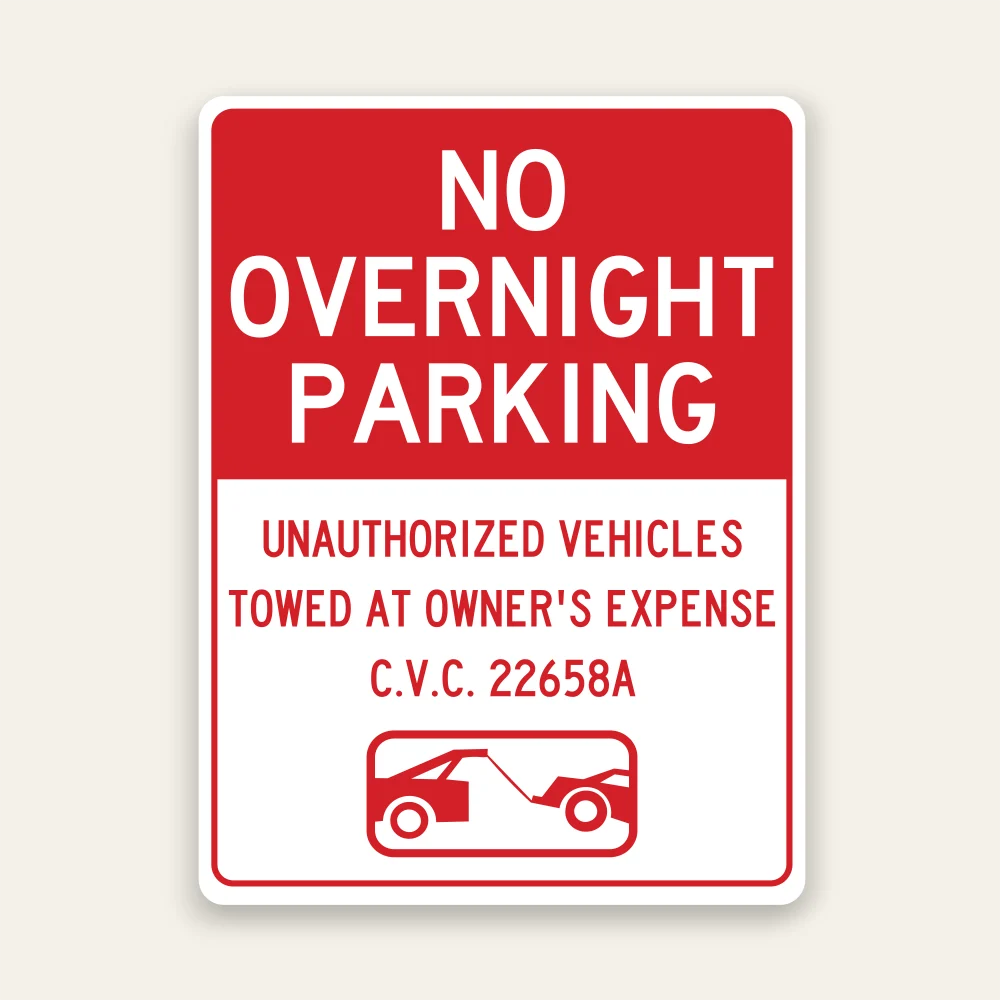 Red and white No Overnight Parking sign with bold white header text, unauthorized vehicles tow-away warning, C.V.C. 22658A, and tow truck icon.