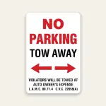 Red and white No Parking Tow Away sign with bold red NO PARKING, black TOW AWAY text, double-headed red arrow, and L.A.M.C. 80.71.4 and C.V.C. 22658A citations.