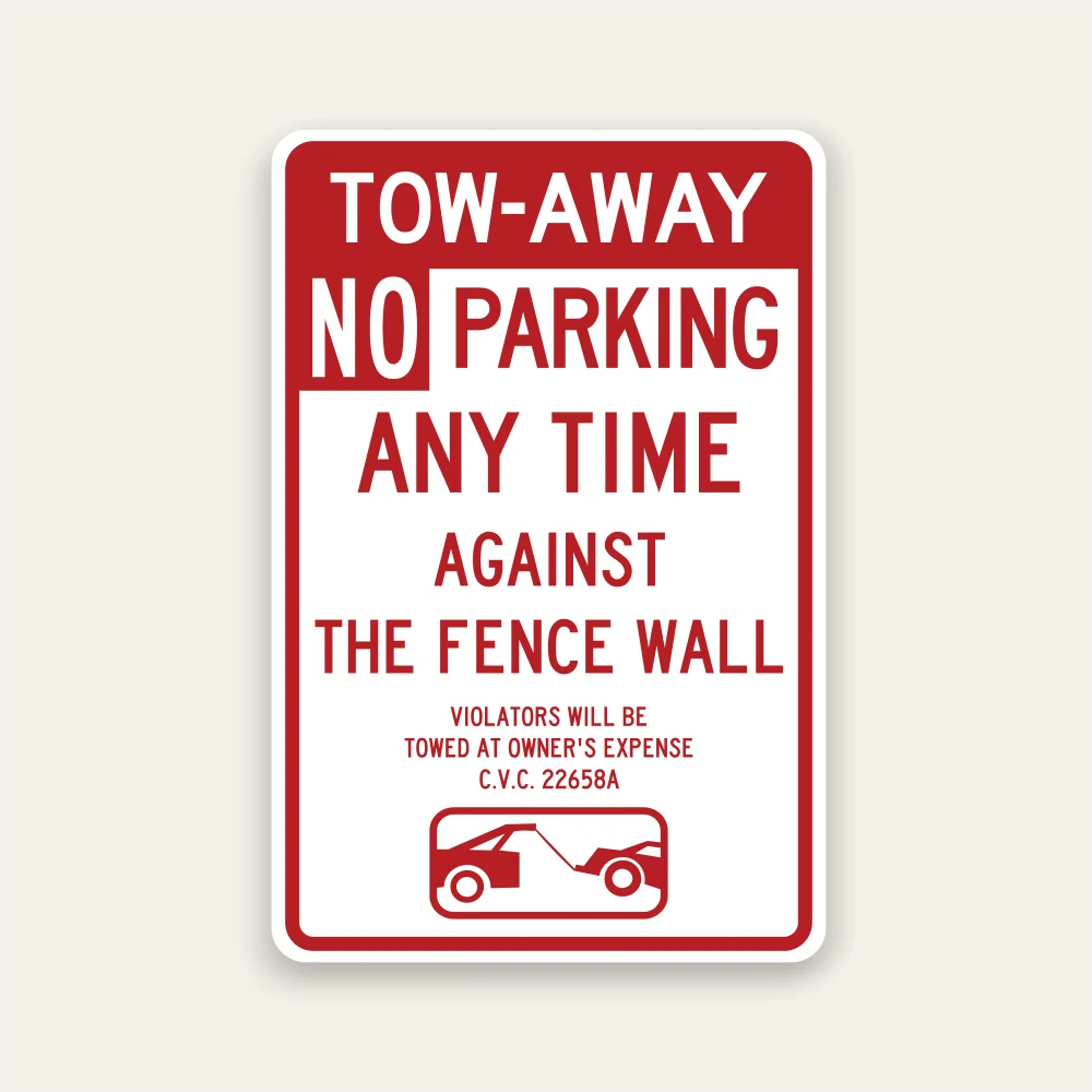 Red and white Tow-Away No Parking Any Time Against the Fence Wall sign with tow-away warning, C.V.C. 22658A citation, and tow truck icon.