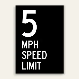 Black and white 5 MPH Speed Limit sign with oversized white number 5 and MPH SPEED LIMIT text below on full black panel.
