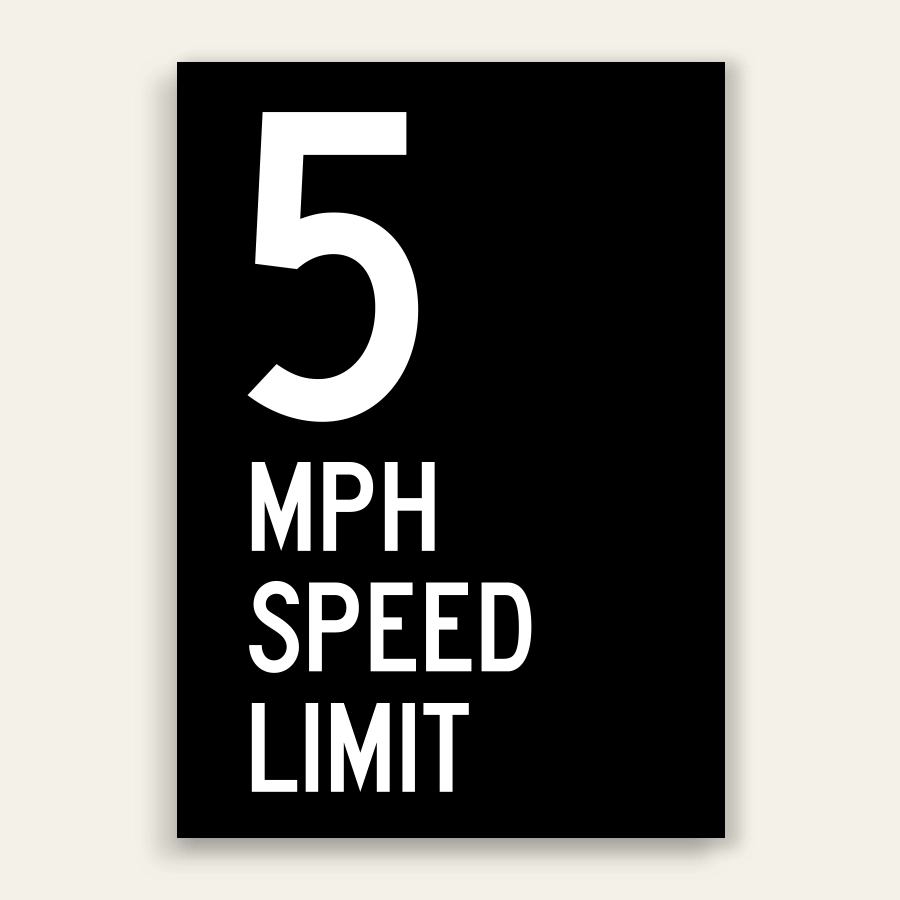 Black and white 5 MPH Speed Limit sign with oversized white number 5 and MPH SPEED LIMIT text below on full black panel.