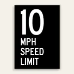 Black and white 10 MPH Speed Limit sign with oversized white number 10 and MPH SPEED LIMIT text below on full black panel.