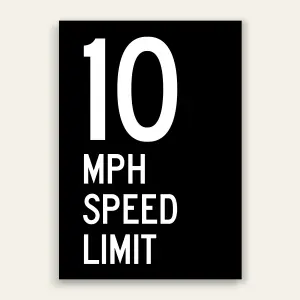 Black and white 10 MPH Speed Limit sign with oversized white number 10 and MPH SPEED LIMIT text below on full black panel.