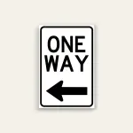 Black and white One Way sign with bold ONE WAY text and full-width left-pointing arrow below, rounded black border.