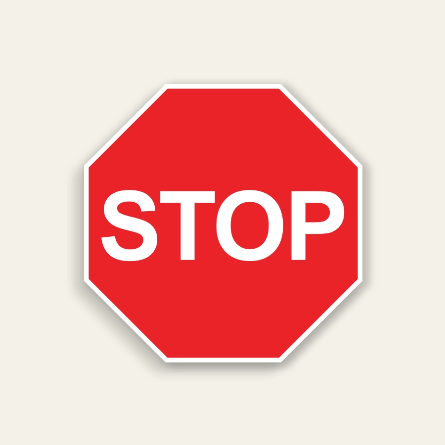 Red octagon stop sign with white border and bold white STOP text centered on the panel.