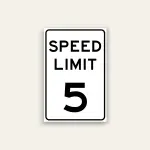 White portrait speed limit sign with rounded black border and black text reading SPEED LIMIT above a large numeral 5.