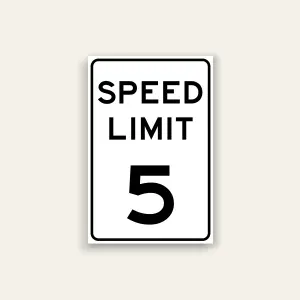 White portrait speed limit sign with rounded black border and black text reading SPEED LIMIT above a large numeral 5.