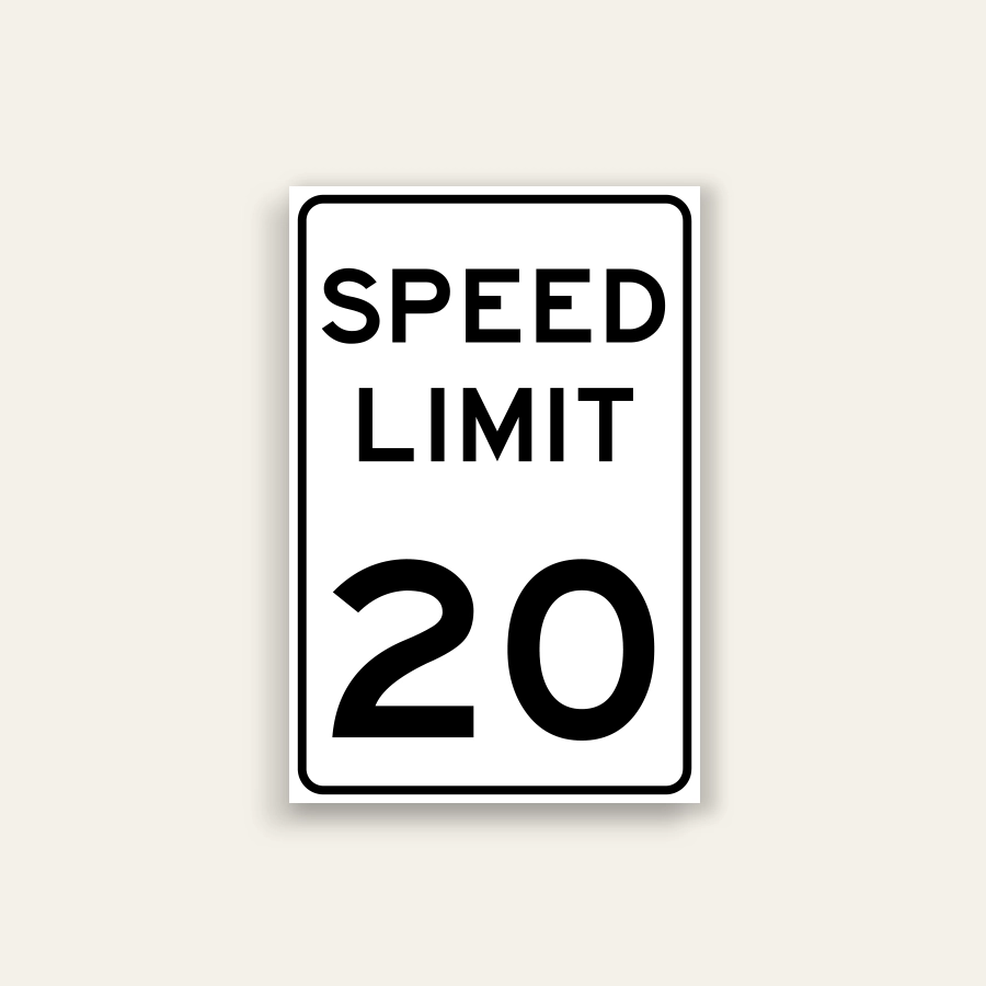 White portrait speed limit sign with rounded black border and black text reading SPEED LIMIT above a large numeral 20.