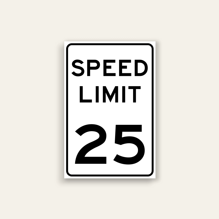 White portrait speed limit sign with rounded black border and black text reading SPEED LIMIT above a large numeral 25.