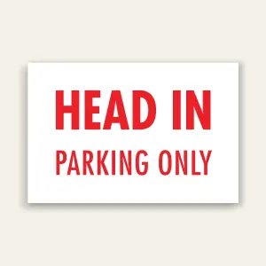 White landscape sign with bold red text reading HEAD IN above smaller PARKING ONLY text, no border.