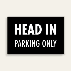 Black landscape sign with bold white text reading HEAD IN above smaller PARKING ONLY text, no border.