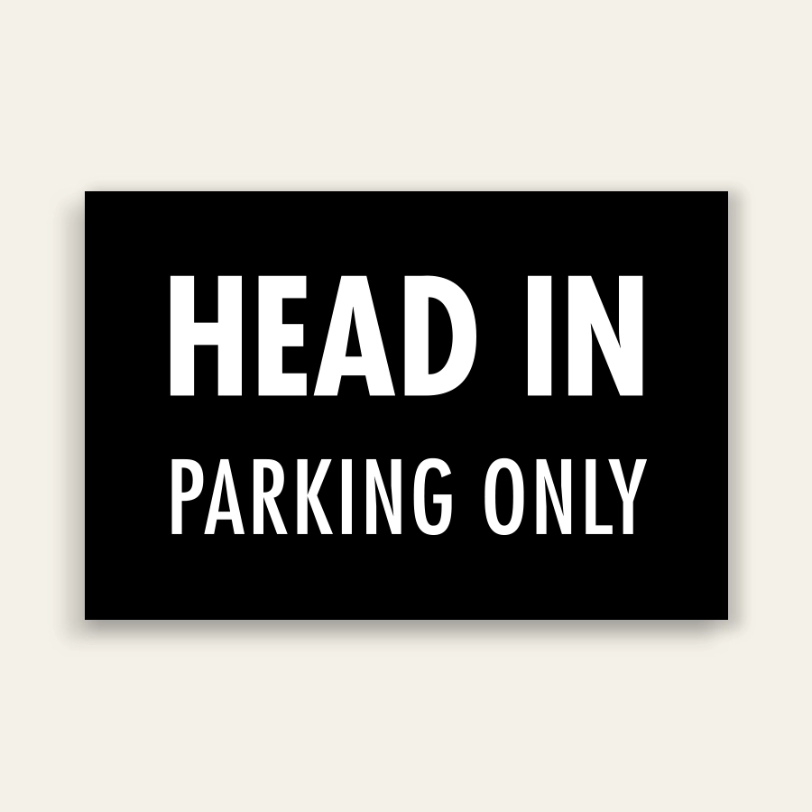 Black landscape sign with bold white text reading HEAD IN above smaller PARKING ONLY text, no border.