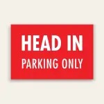 Red landscape sign with bold white text reading HEAD IN above smaller PARKING ONLY text, no border.