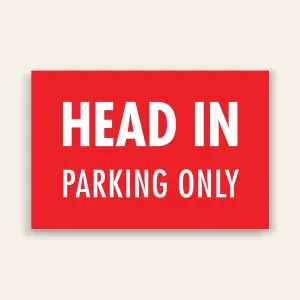 Red landscape sign with bold white text reading HEAD IN above smaller PARKING ONLY text, no border.