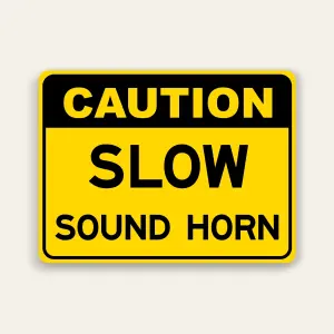 Yellow landscape caution sign with black header reading CAUTION above large black SLOW text and SOUND HORN below, rounded black border.