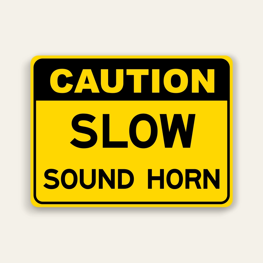 Yellow landscape caution sign with black header reading CAUTION above large black SLOW text and SOUND HORN below, rounded black border.