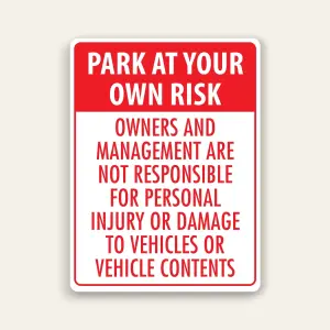 Red and white portrait sign with red header reading PARK AT YOUR OWN RISK above red text stating owners and management are not responsible for personal injury or damage to vehicles or vehicle contents.