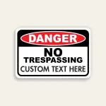 Red, black, and white Danger No Trespassing sign with ANSI DANGER oval, fixed NO TRESPASSING text, and Custom Text Here line below.