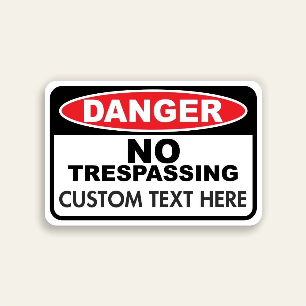 Red, black, and white Danger No Trespassing sign with ANSI DANGER oval, fixed NO TRESPASSING text, and Custom Text Here line below.